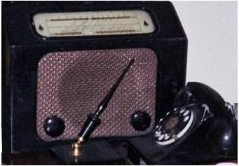 Bush Radio Ltd radio old telephone and pen in holder
