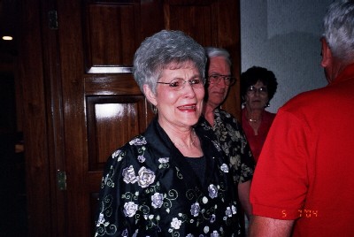 Mom crying as she recognizes more people.  The man in the red shirt is her brother.  His wife is standing behind my stepfather.